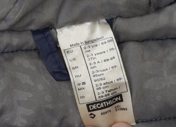 Close-up detail of Decathlon girls’ blue puffer jacket 2-3 years hooded lightweight