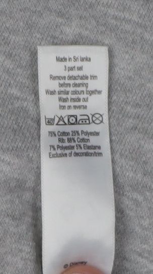 Brand and care label for George girls’' grey disney sweatshirt 6-7 years pullover
