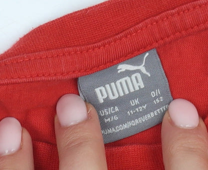 Close-up detail of Puma boys’ red t-shirt, 11-12 years, logo style