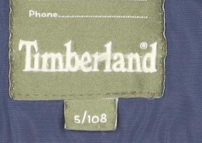 Close-up detail of Timberland boys’ blue puffer jacket, size 8