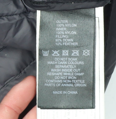 Brand and care label for Puffa boys’ black puffer jacket l lightweight insulated