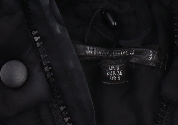 Brand and care label for Missguided Women's Black Hooded Puffer Jacket, size 8