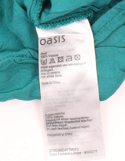 Close-up detail of Oasis Green Sleeveless Ruffle Blouse, size 10
