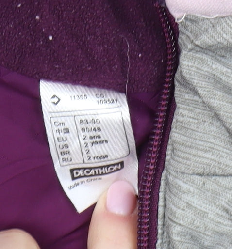 Brand and care label for Decathlon girls’ grey pink puffer jacket 2-3 years