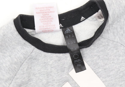 Close-up detail of Adidas boys’ grey pullover sweatshirt 3-4 years - logo accent