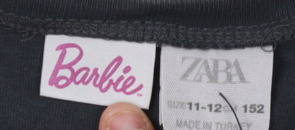 Close-up detail of Barbie girls’ black cropped t-shirt 11-12 years graphic logo
