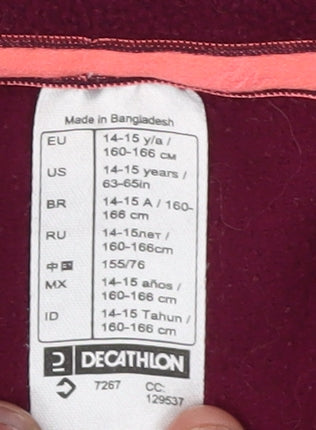 Close-up detail of Decathlon girls’ red fleece jacket mid-length 14 years