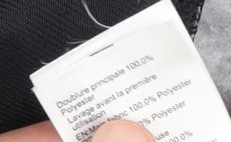 Close-up detail of Quechua boys’ grey fleece jacket 11-12 years