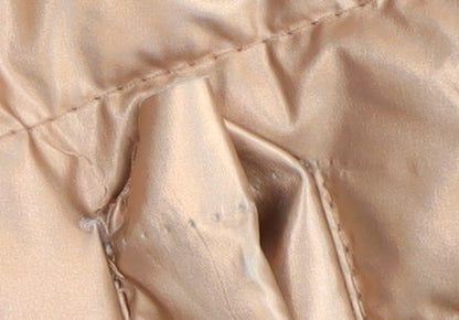 Close-up detail of Mountain Warehouse girls’ beige puffer jacket 13 years