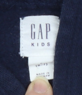 Brand and care label for Gap girls’ blue pullover hoodie, size S, long sleeve casual wear