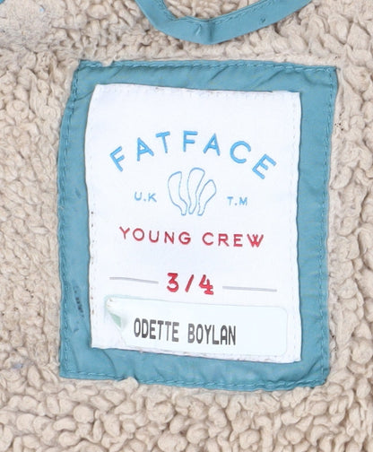 Close-up detail of FatFace girls’ blue long puffer jacket 3-4 winter coat