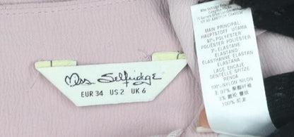 Close-up detail of Miss Selfridge Women's Pink Lace Accent Blouse, size 6