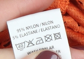 Close-up detail of Atmosphere Women's Orange Kimono Tunic, size 8
