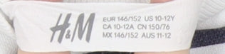 Close-up detail of H&M girls’ white 'new york' sweatshirt 146 pullover