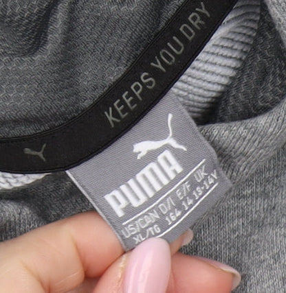 Close-up detail of Puma boys’ grey pullover hoodie xl with logo accent