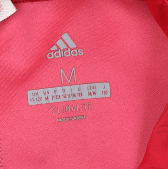 Close-up detail of Adidas girls’ purple cropped leggings m - athletic style