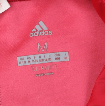 Close-up detail of Adidas girls’ purple cropped leggings m - athletic style