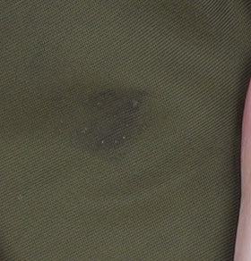 Close-up detail of ASOS Men's Green Bomber Jacket, S, Zipped Pockets