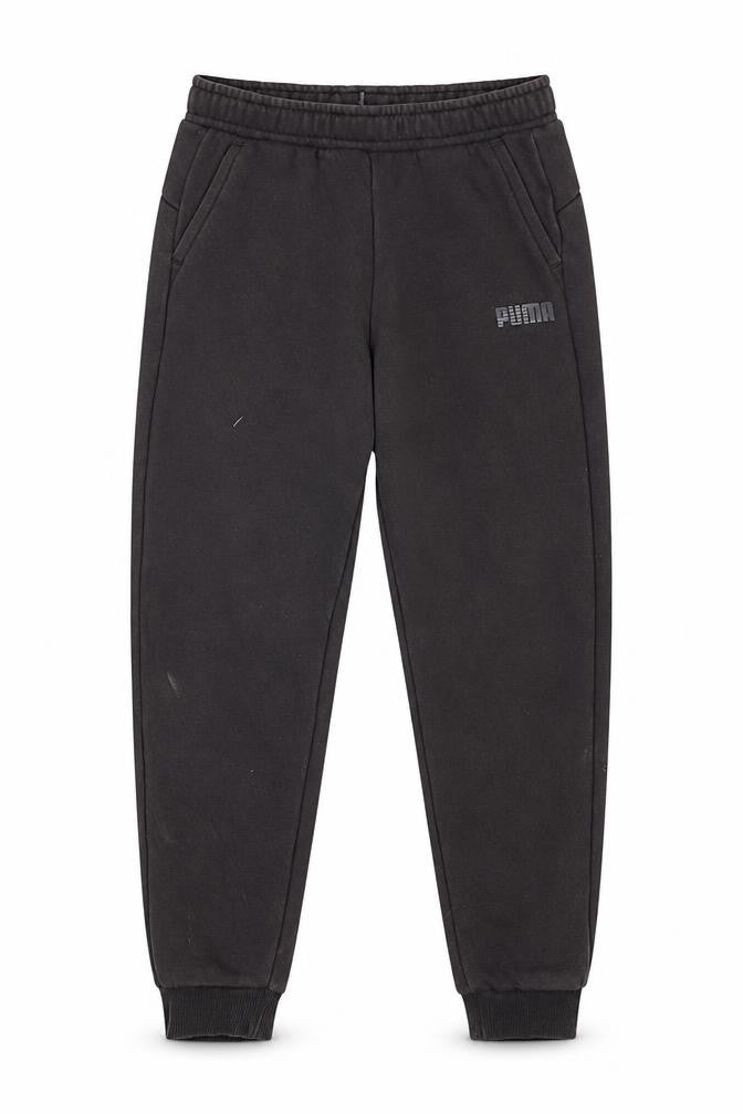 Front view of Puma boys’ black jogger trousers, size 7-8, years