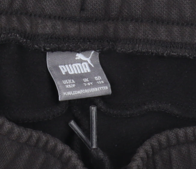 Brand and care label for Puma boys’ black jogger trousers, size 7-8, years