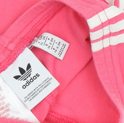 Close-up detail of Adidas girls’ pink jogger trousers - 9 months, side stripe