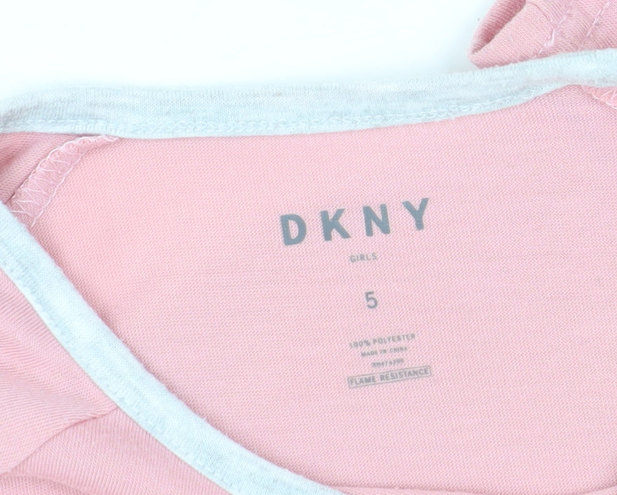 Close-up detail of DKNY girls’ pink long sleeve t-shirt, size 5, pullover style