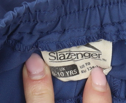 Brand and care label for Slazenger boys’ blue athletic shorts 9-10 years