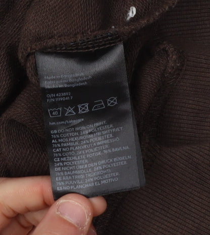 Brand and care label for H&M boys’ brown sonic sweatshirt 11-12 years