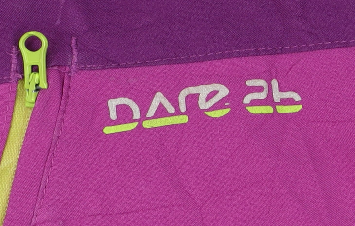 Brand and care label for Dare 2b girls’ purple ski jacket, size 10, waterproof & hooded