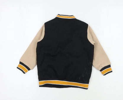 Back view of Urban Junior boys’ black varsity jacket 3-4 years