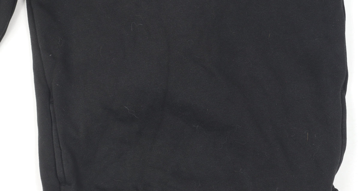 Close-up detail of Puma boys’ black hoodie pullover 11-12 years sports logo