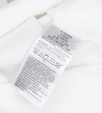 Brand and care label for Gap girls’ full zip white hoodie with rainbow logo, size 5
