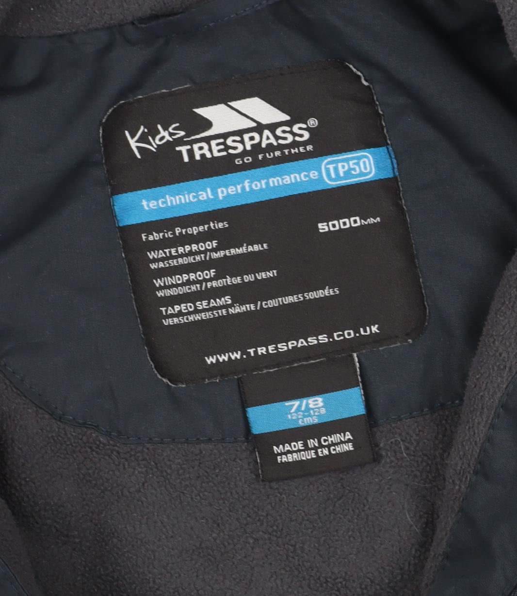 Brand and care label for Trespass boys’ black parka jacket 7-8 years, waterproof winter coat