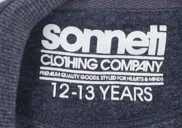 Close-up detail of Sonneti boys’ blue camouflage graphic sweatshirt 12-13 years