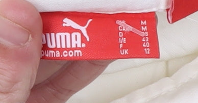 Close-up detail of Puma Women's White Trousers, size 12, Casual Style
