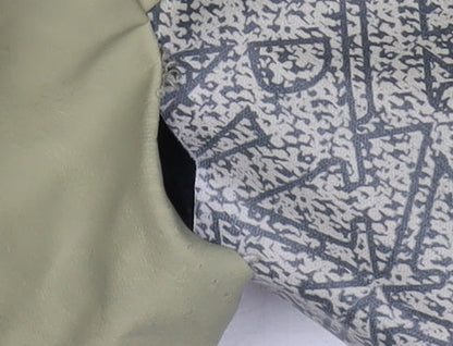 Close-up detail of River Island boys’ green geometric rain coat - 12-18 months
