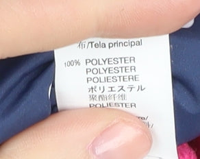 Close-up detail of Baby Gap girls’ blue polka dot puffer jacket 2 years