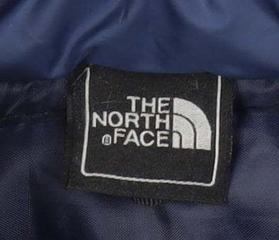 Close-up detail of The North Face boys’ blue puffer vest, size 5