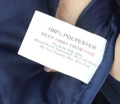 Brand and care label for The North Face boys’ blue puffer vest, size 5