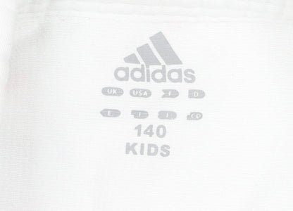 Brand and care label for Adidas boys’ white track jacket 11 years cotton blend