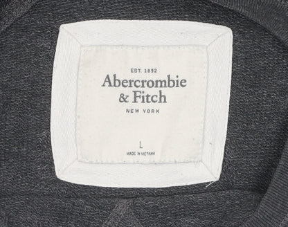 Brand and care label for Abercrombie & Fitch girls’ black sequin pullover sweatshirt, size L