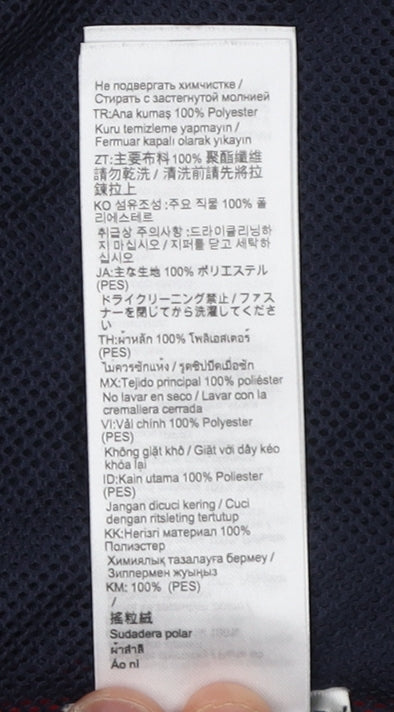 Brand and care label for Decathlon girls’ blue fleece waistcoat 8-9 years