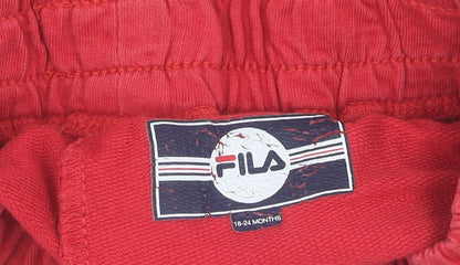 Brand and care label for Fila boys’ red athletic shorts age 2-3 elastic waist