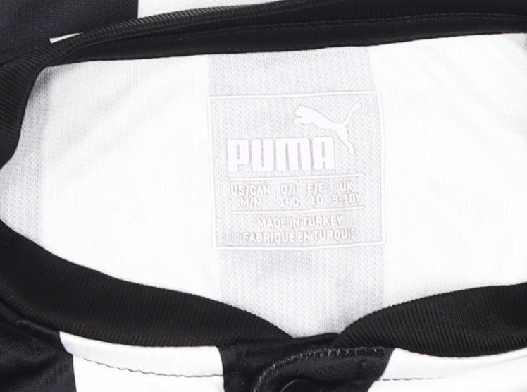 Close-up detail of Puma boys’ football jersey black white stripe 9-10 years
