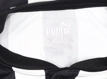 Close-up detail of Puma boys’ football jersey black white stripe 9-10 years