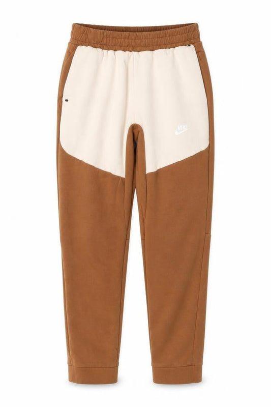 Front view of Nike boys’ brown beige jogger trousers, size 176