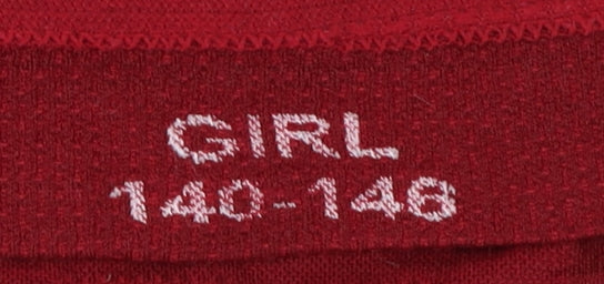 Brand and care label for Brubeck girls’ red pullover top, size 12, long sleeve athletic