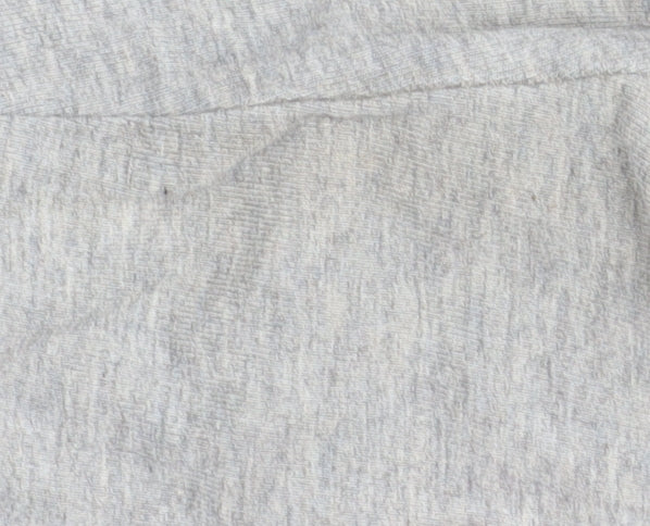 Close-up detail of Adidas girls’ grey track pants 9-10 years