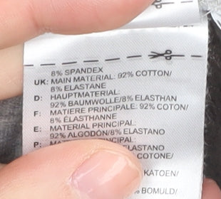Brand and care label for Adidas girls’ grey track pants 9-10 years