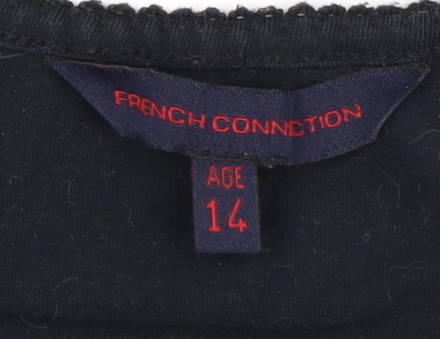 Close-up detail of French Connection girls’ black tank top, size 14, accented logo